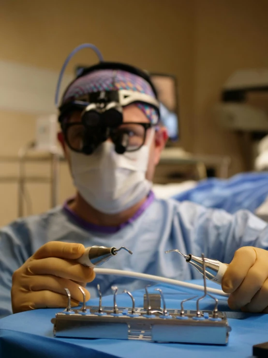 a surgeons performing  in a room