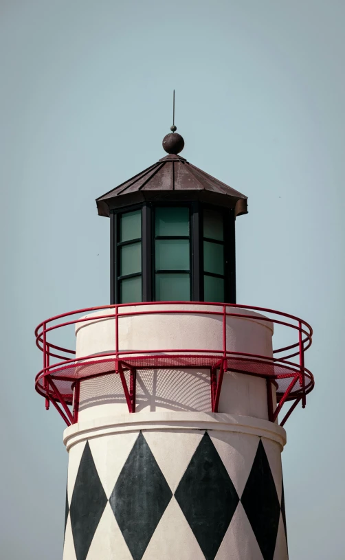 a large round tower with a flag on it