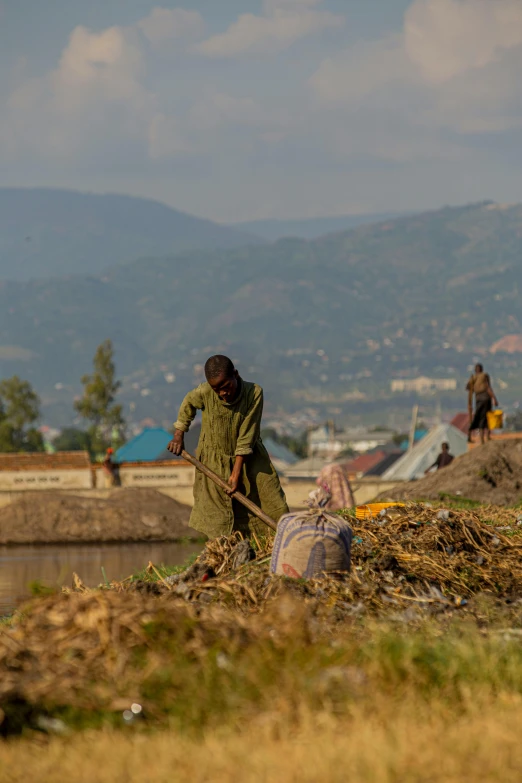 a man is working on land with his stick