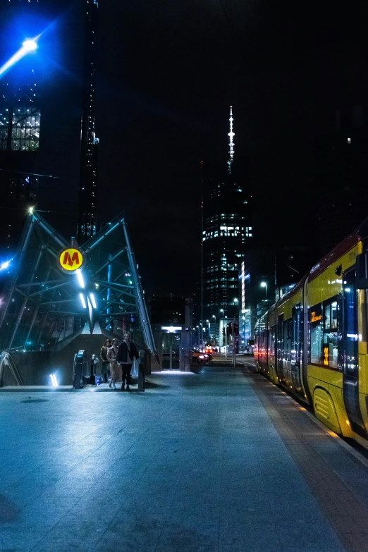 people are waiting for a train at the platform