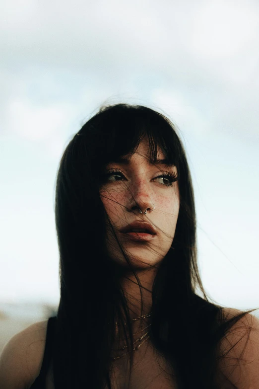 a close up of a woman posing for the camera