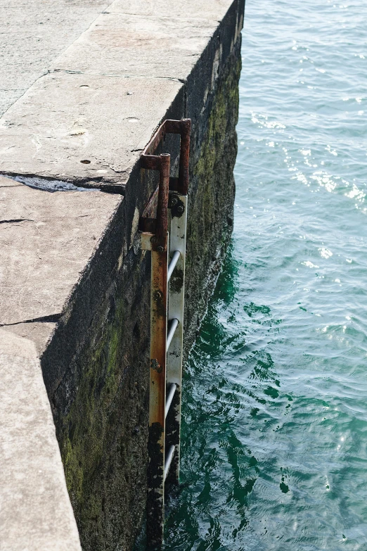 a man is standing on the edge of a pier