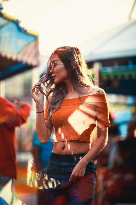 woman with sun glasses and crop top smoking a cigarette