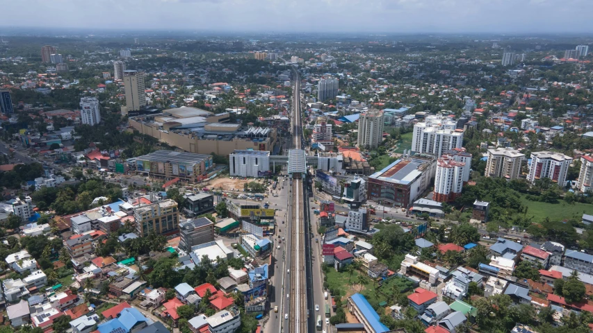 an aerial view of a street and buildings in city