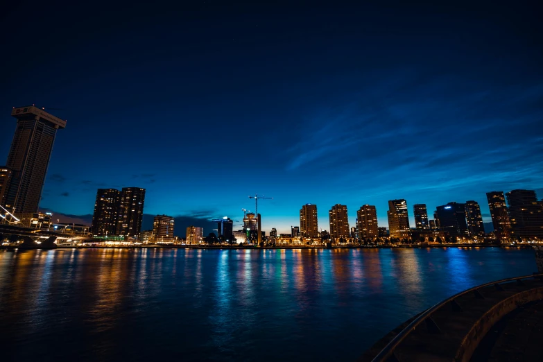 a view of city at night, with the lights on