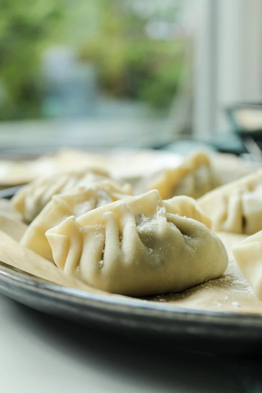 some dumplings that are sitting on a plate