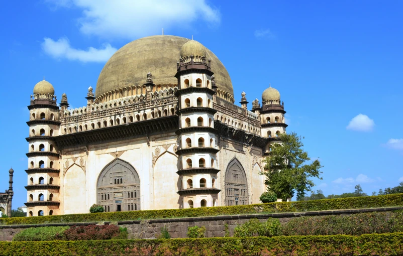 a beautiful old looking building with domes on top