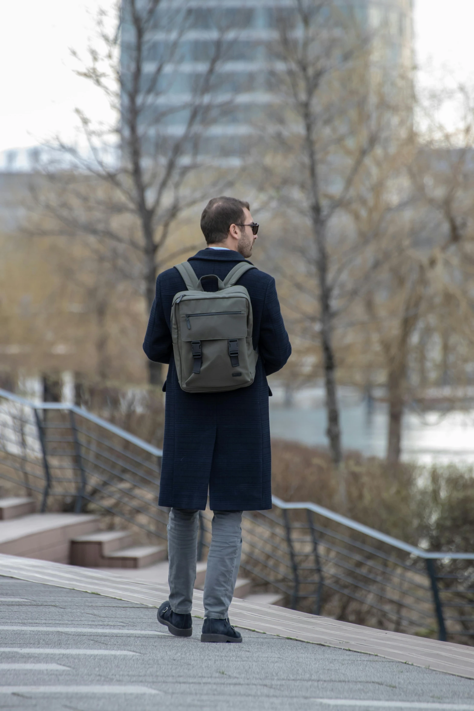 a person is walking while wearing a backpack