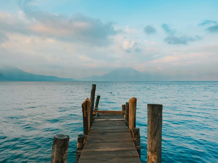 a pier sitting in the middle of a body of water