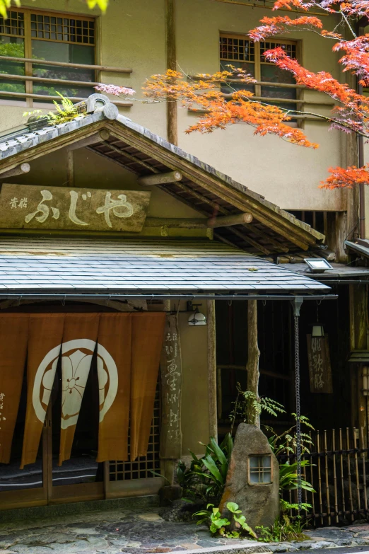 an oriental style building with two covered in hanging orange flags