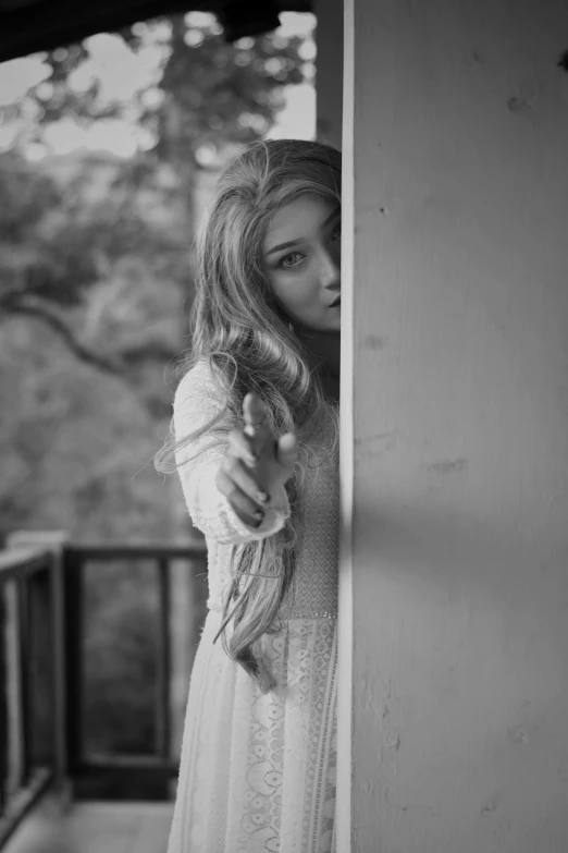 black and white pograph of a girl in the middle of a hallway