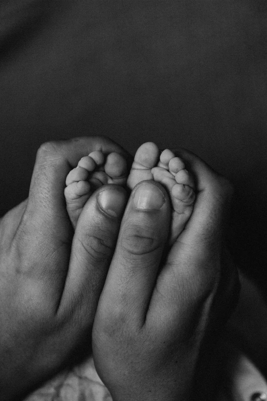 a close up of the hands of a baby