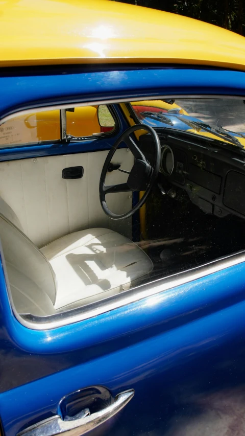 a blue car parked in front of a building