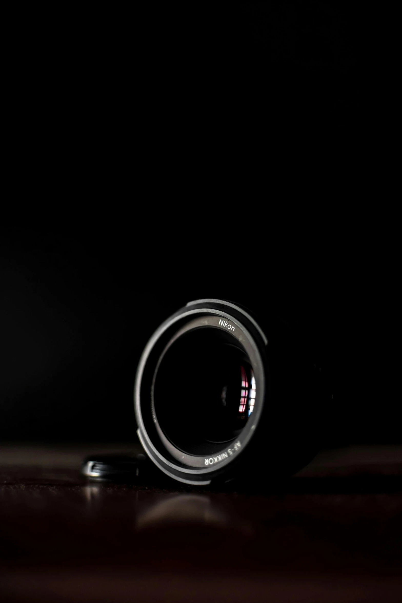 a lens on the table and on top of the phone