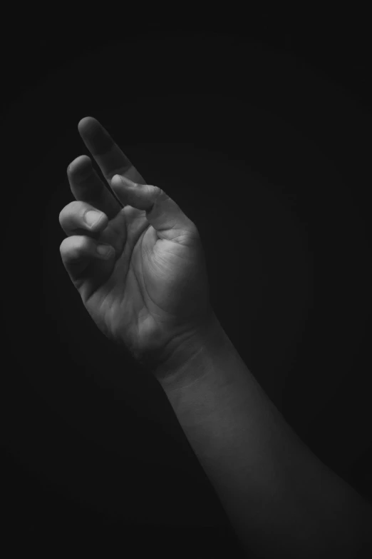 a hand is showing an open sign with its fingers