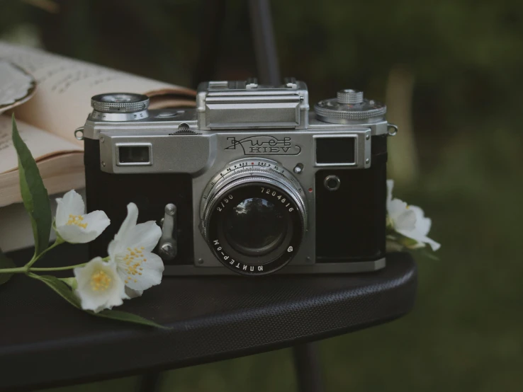 an old fashioned camera sitting on top of a table