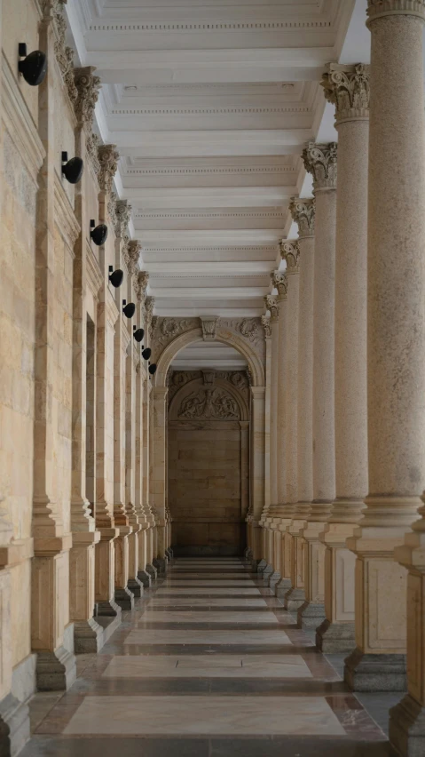 rows of columns in the hallway leading to the doors