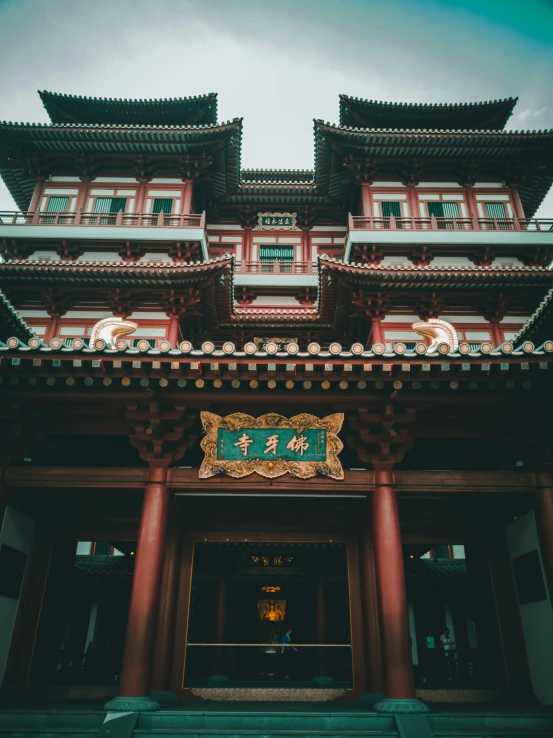 a very large ornate chinese building with an oriental sign