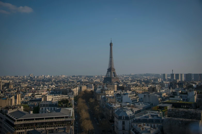 a city with buildings and a tower that has spires