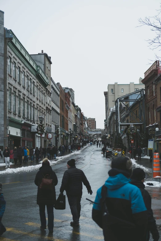 a couple of people that are walking in the snow