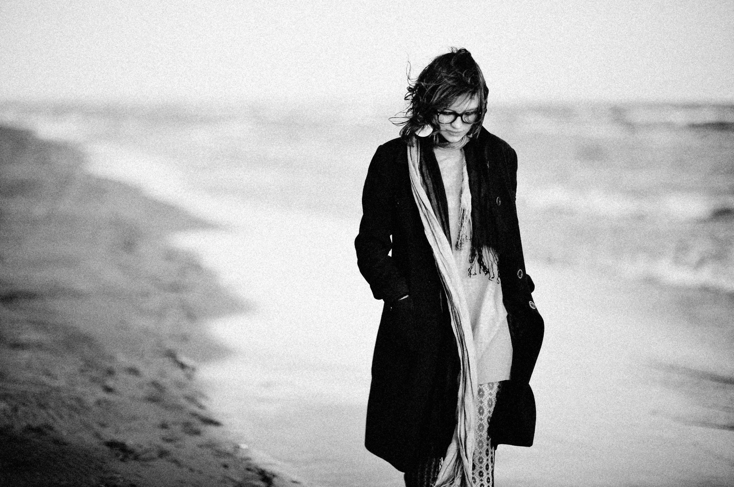 black and white po of girl on the beach