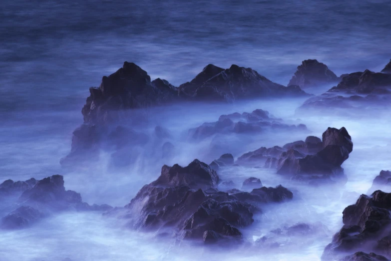 the sea with long exposure shows rock formations