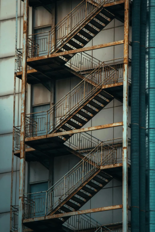 several steel stairs are outside an industrial building