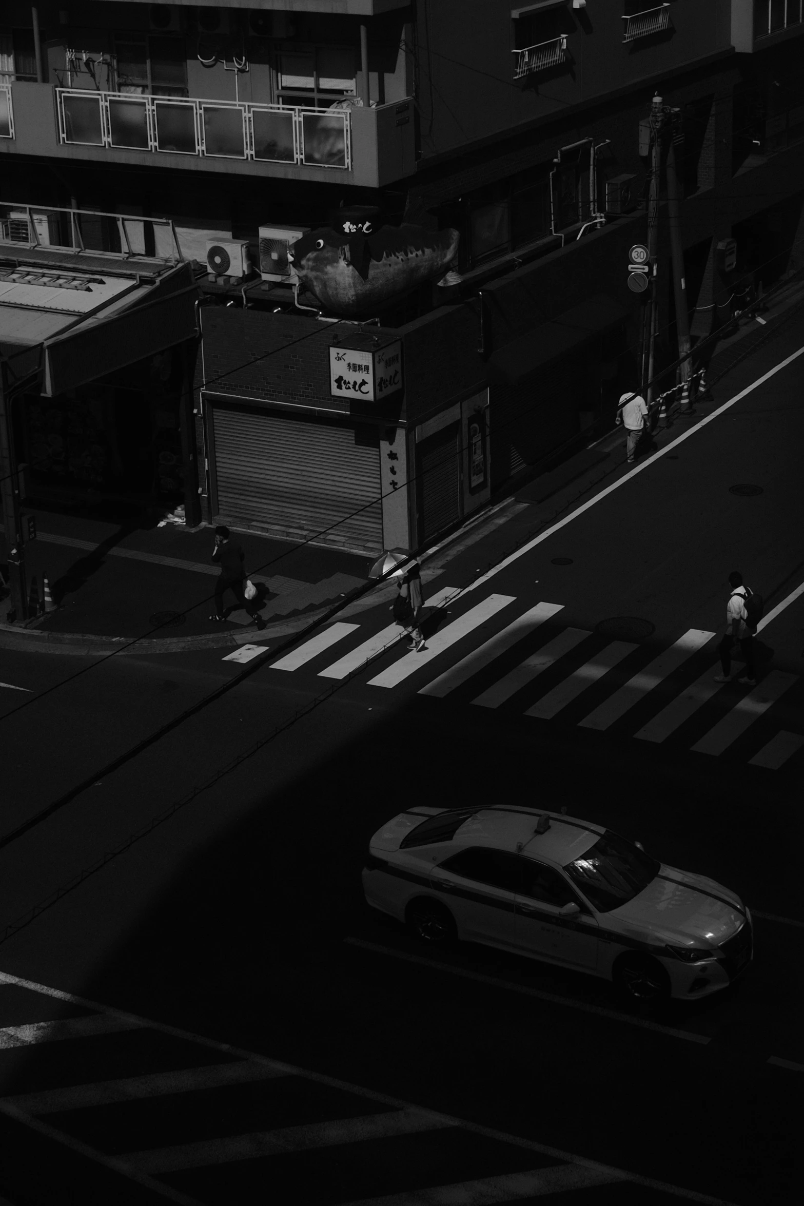 a black and white po of some buildings and cars