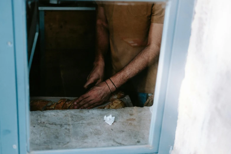 a person wiping down a napkin on the floor