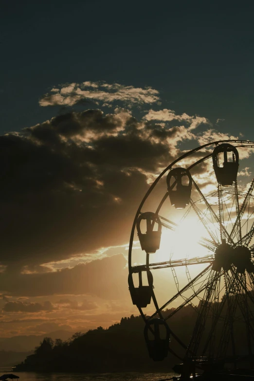 a ferris wheel near a body of water