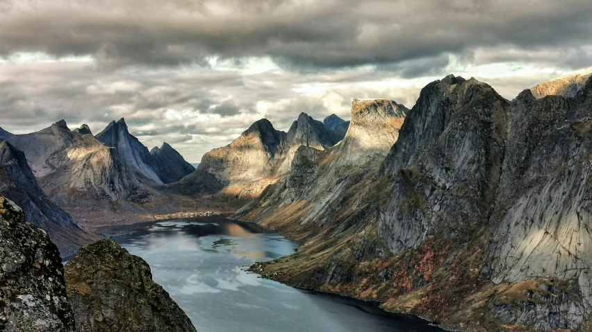 a lake in the mountains is pictured in this scene