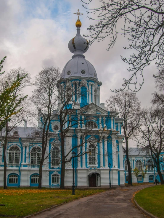 a blue church with a dome with an elaborate design