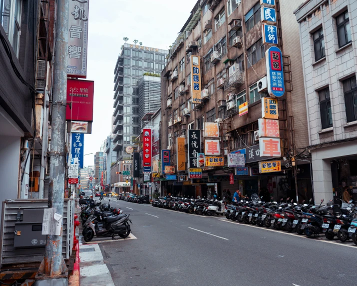 a city street has many advertits on the buildings