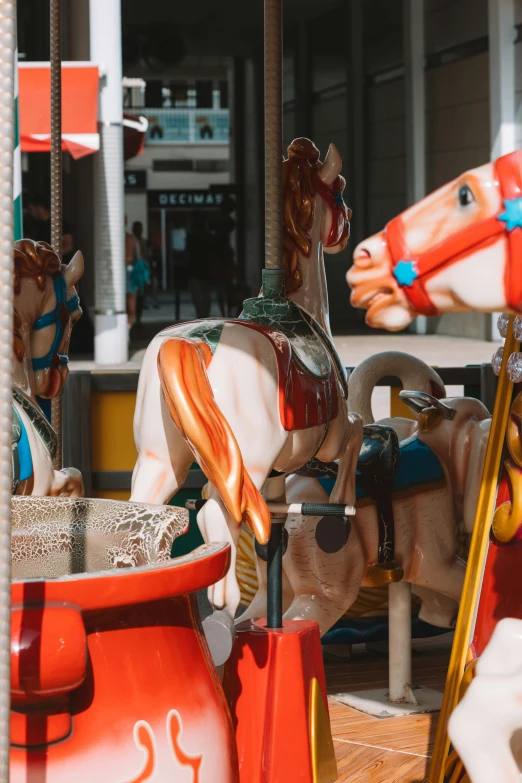 a carousel has horses on it and a basket