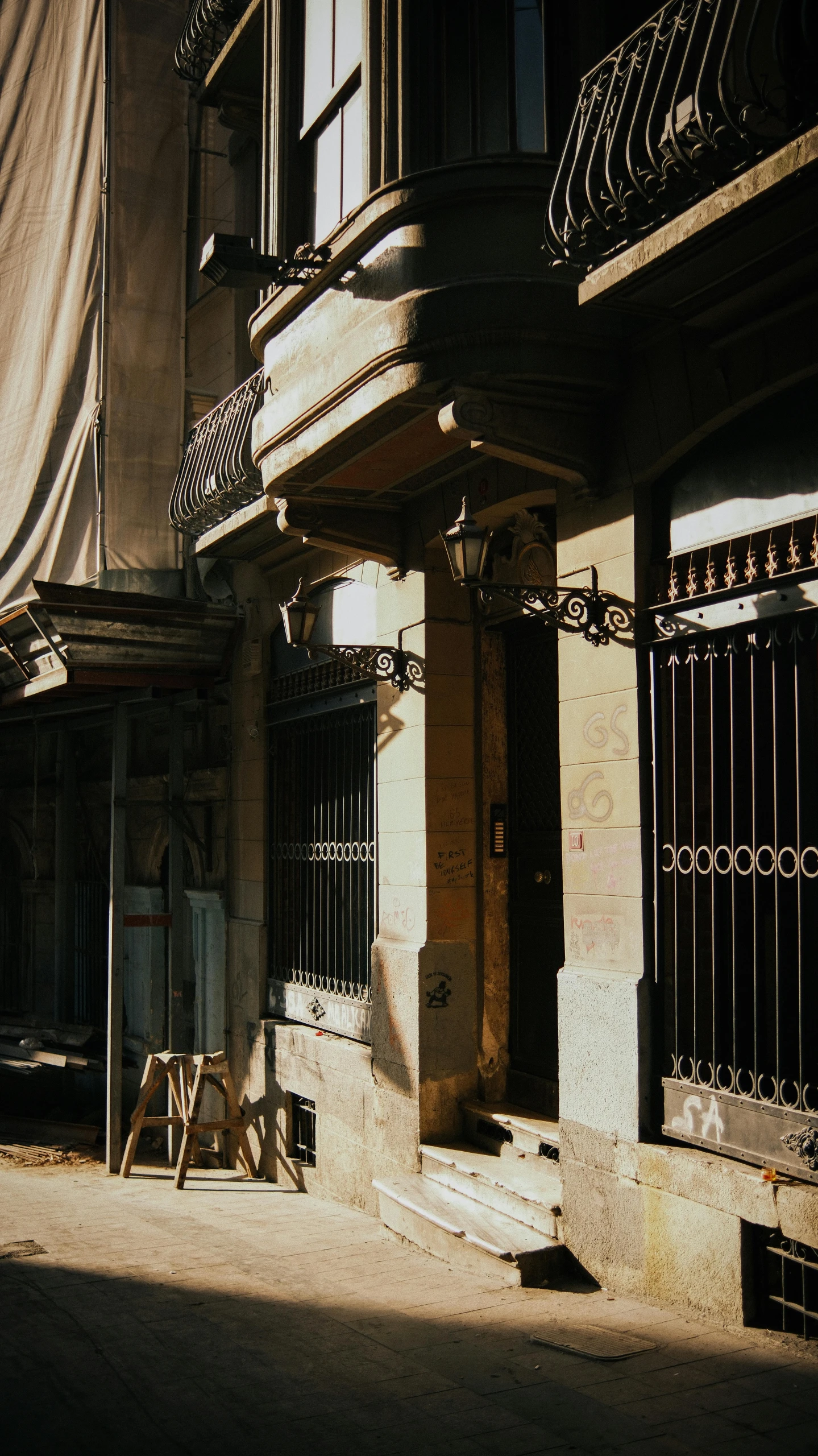 there are several wooden and wrought iron doorways