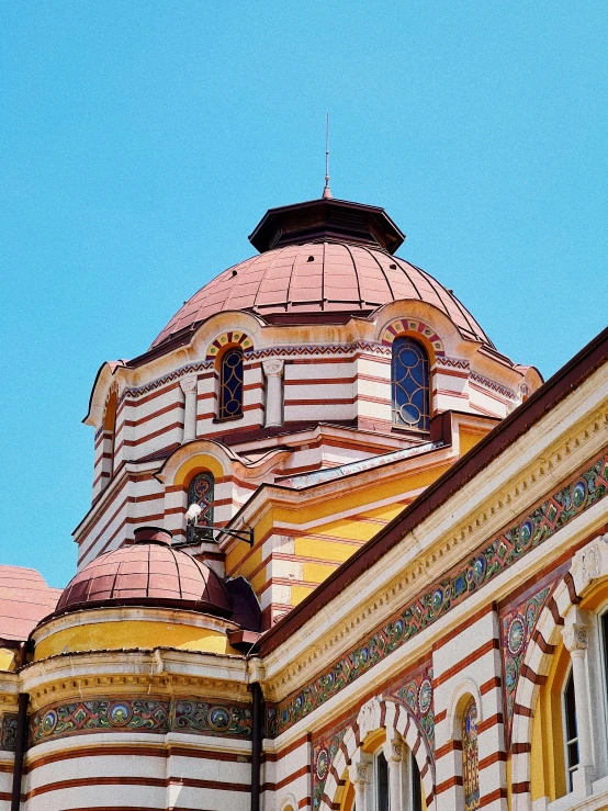 a church's steeple with the sky behind it