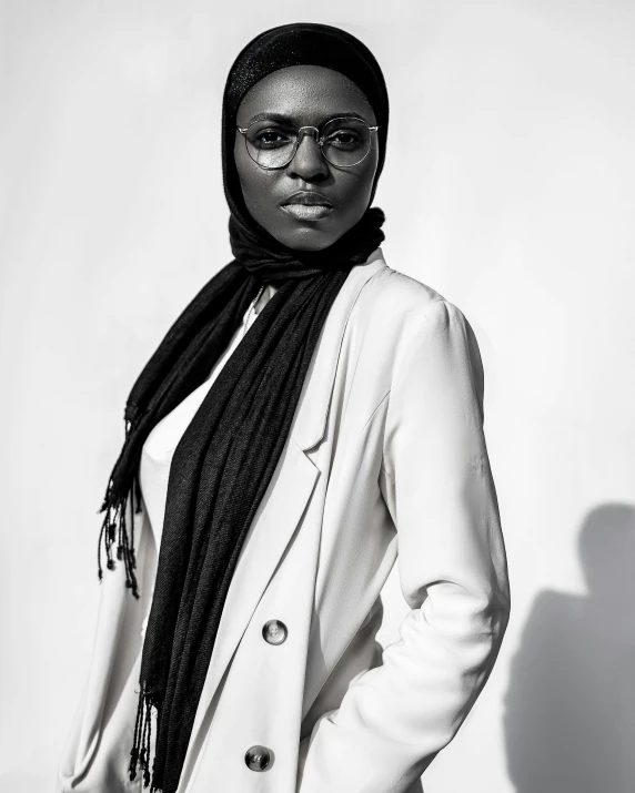 a black and white po of a person in a scarf