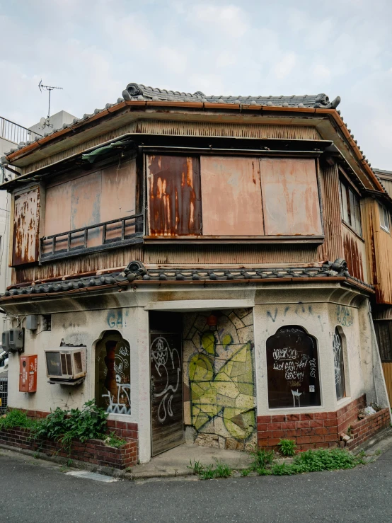 a dilapidated building that has graffiti on it