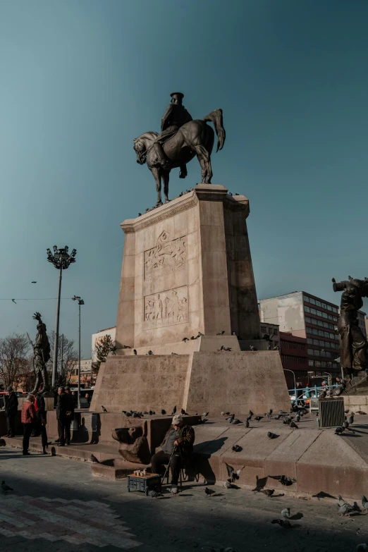 there is an old statue on a horse