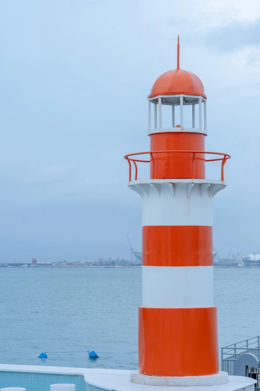 a lighthouse that is on top of some concrete