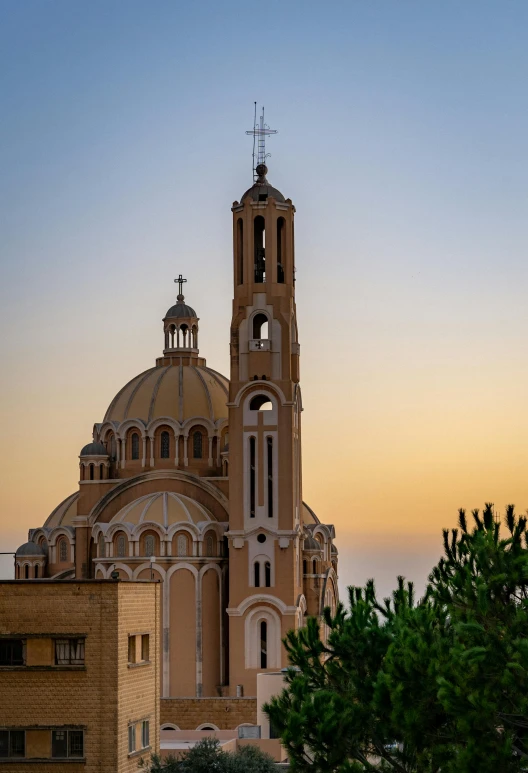 a cathedral tower in front of a building