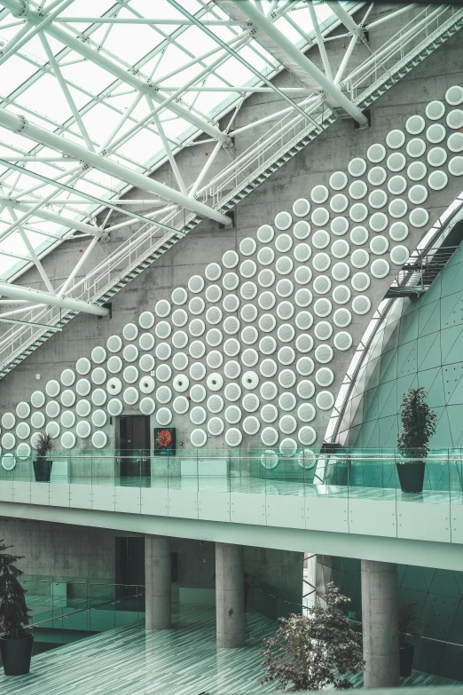 an indoor shopping mall with a very high ceiling