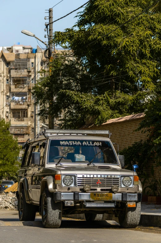 there is a old toyota wagon in a street