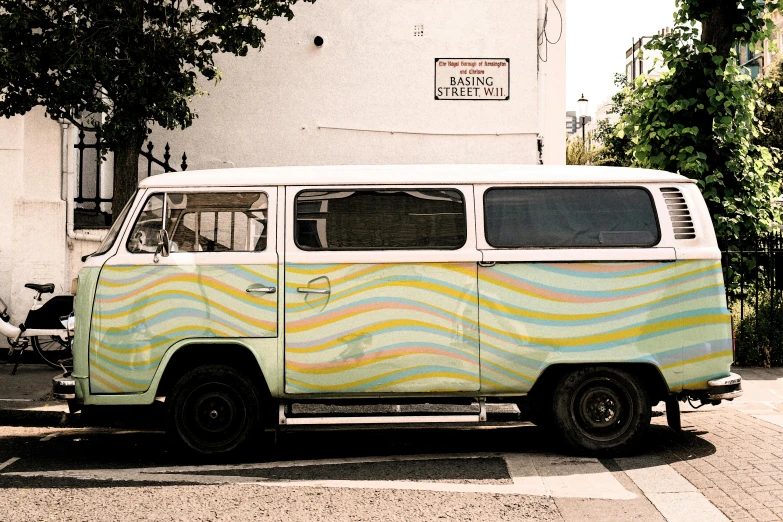 a van parked on the street next to a house