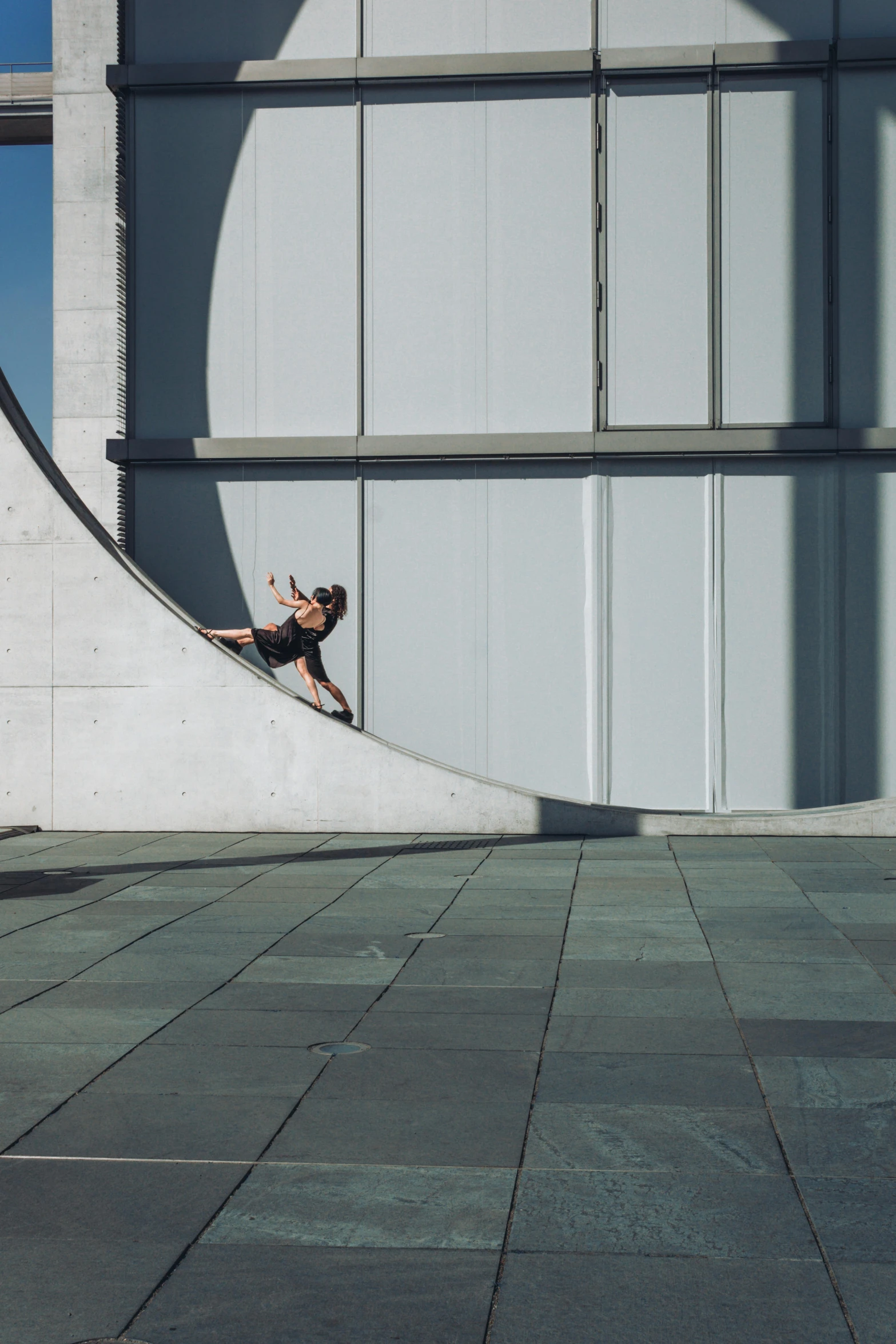 a man is riding on a ramp with his skateboard