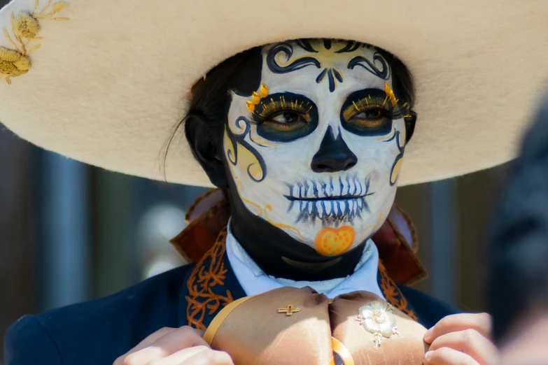 a person with black paint and white makeup