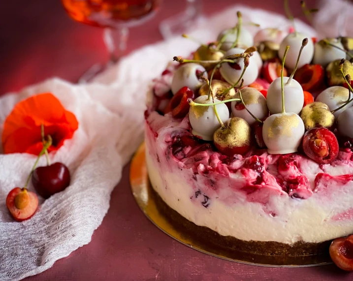 a cake with cherry topping and cherries on top