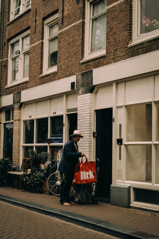 a man standing on the side of the road near a bike