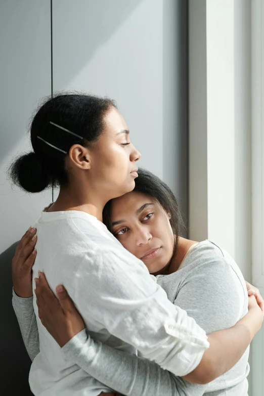 a couple of women that are standing next to each other