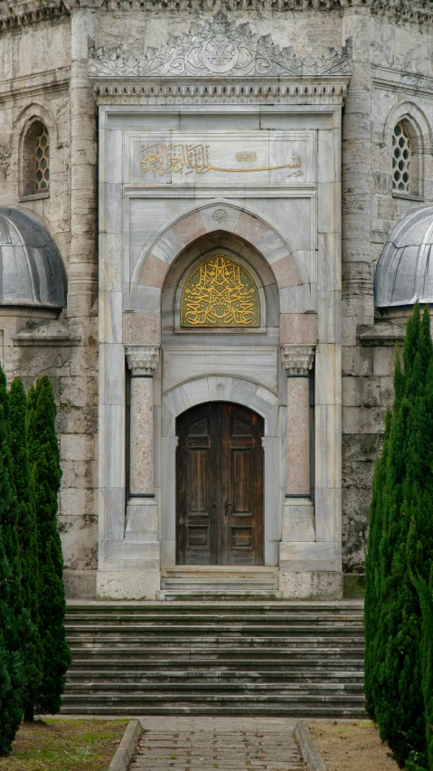 a big building with two wooden doors